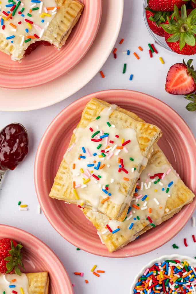 two homemade pop tarts on a pink plate