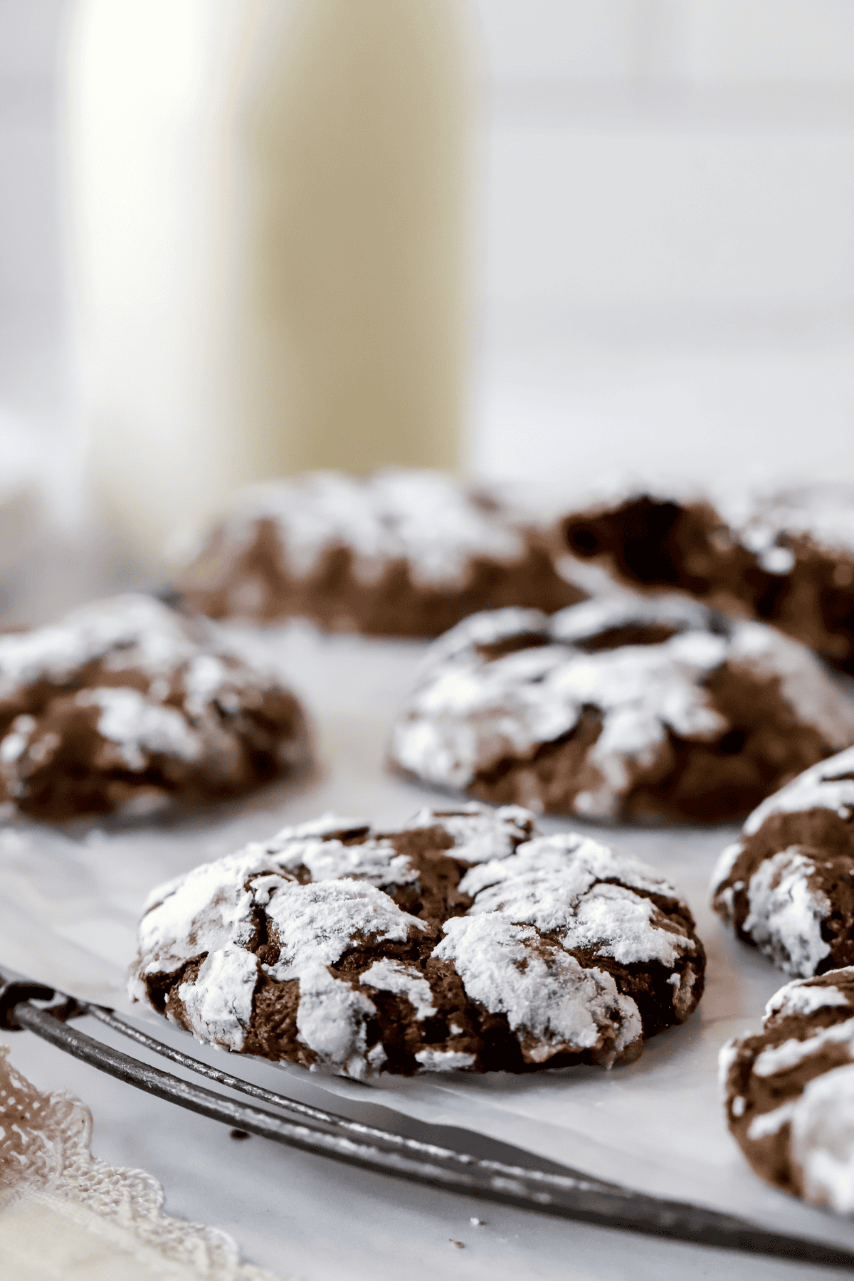 fudgy chocolate crinkle cookies on a rack