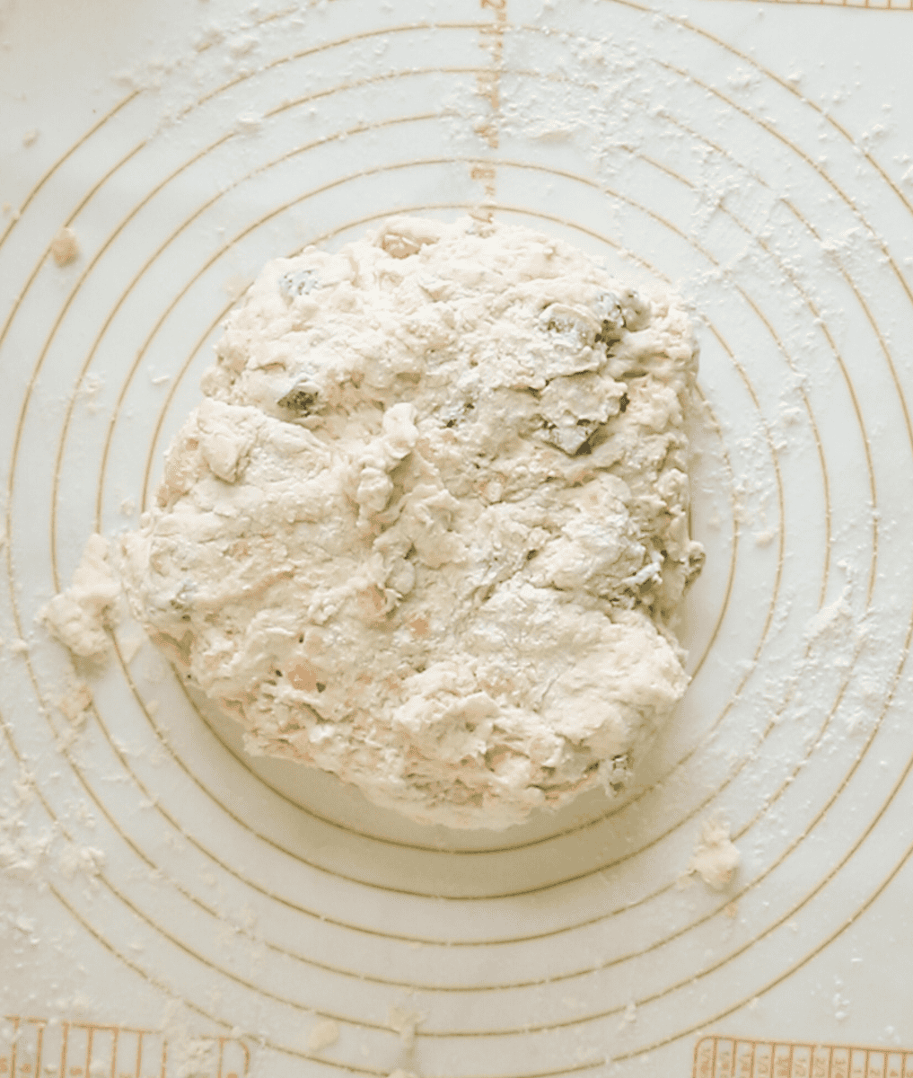 cheddar jalapeno biscuit dough on a floured surface