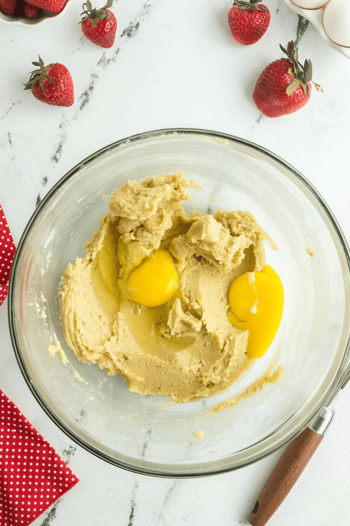 egg and egg yolk added to strawberry cream cheese cookies dough