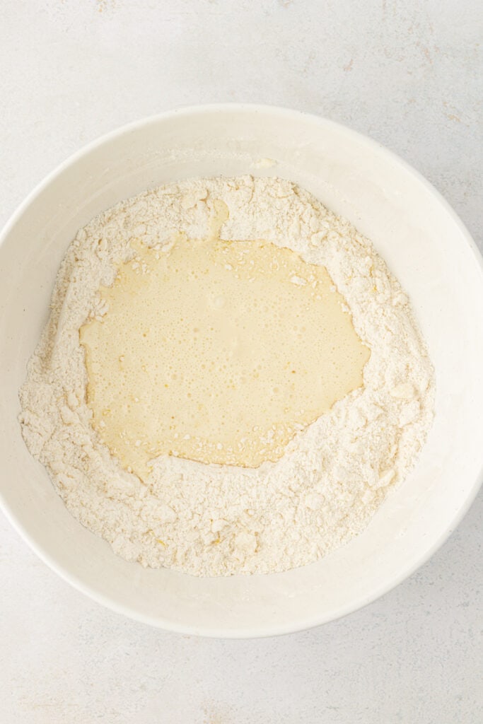 wet ingredients in a well of dry ingredients for lemon scone dough