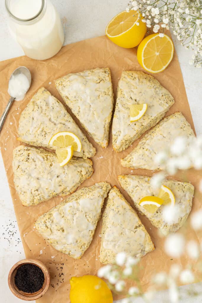 eight lemon poppyseed scones on parchment paper