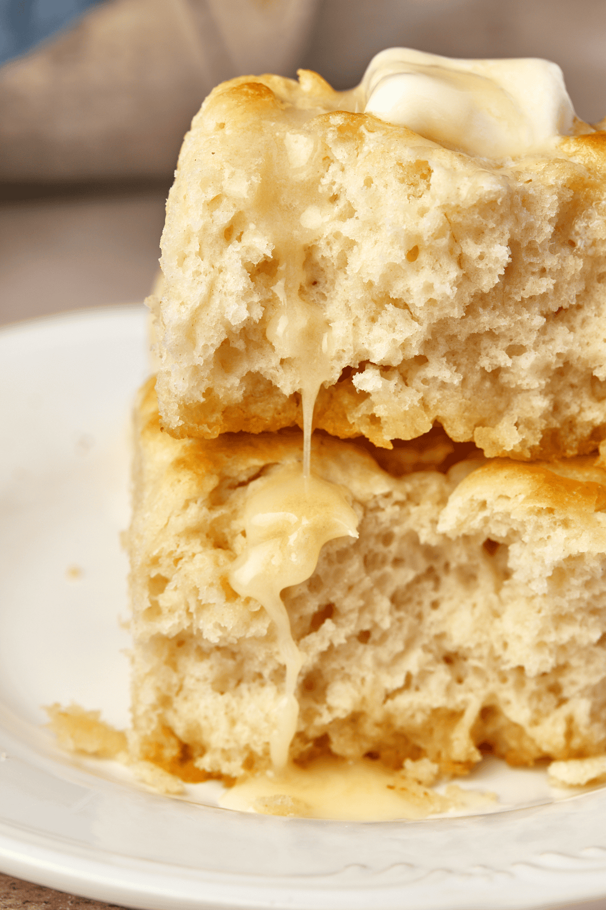 two butter swim biscuits topped with butter