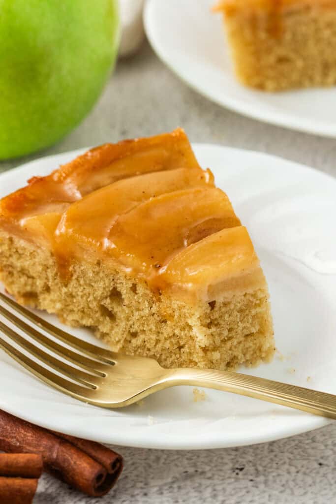 slice of caramel apple upside down cake with a bite taken from it