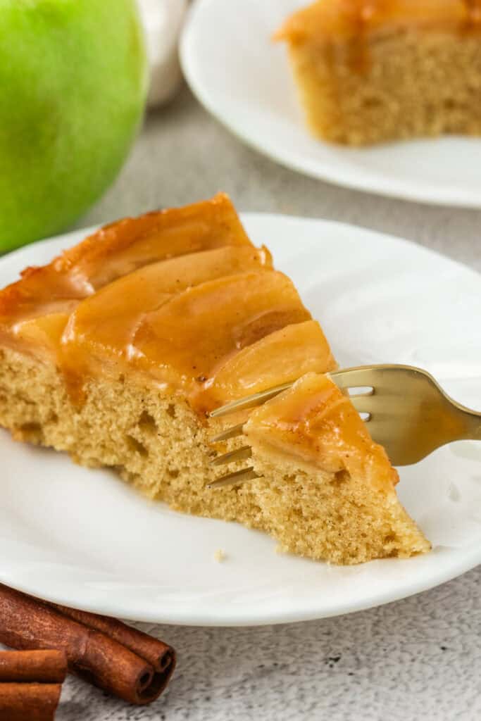 slice of apple upside down cake on a plate