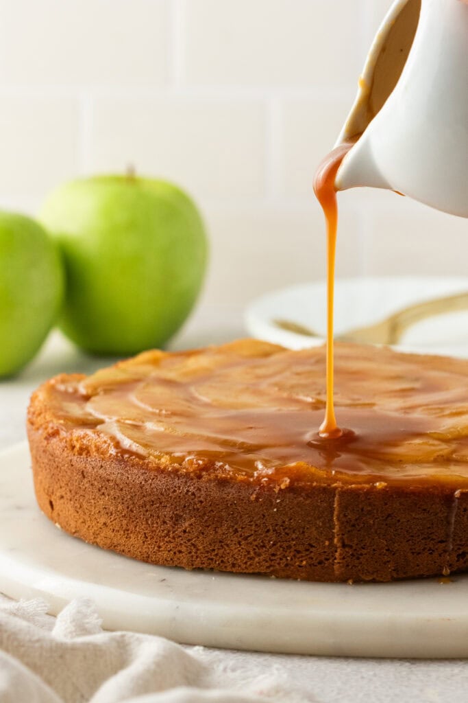 caramel sauce poured over the apple upside down cake
