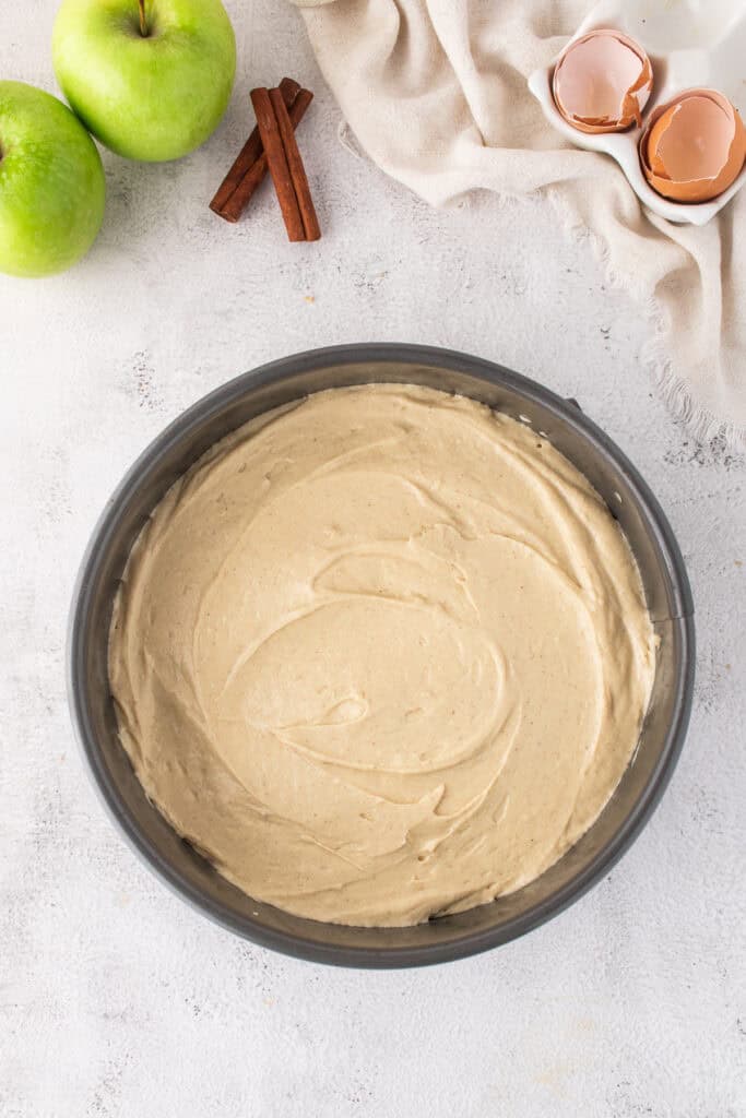 cake batter added on top of the apple mixture