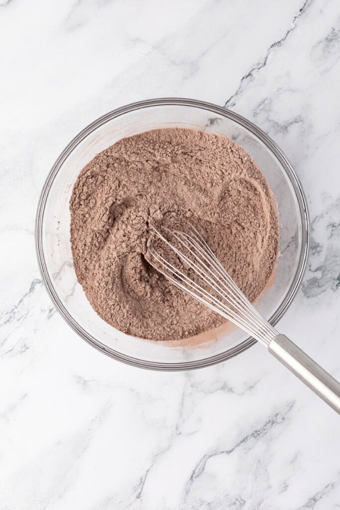 dry ingredients for cookies in a bowl with a whisk