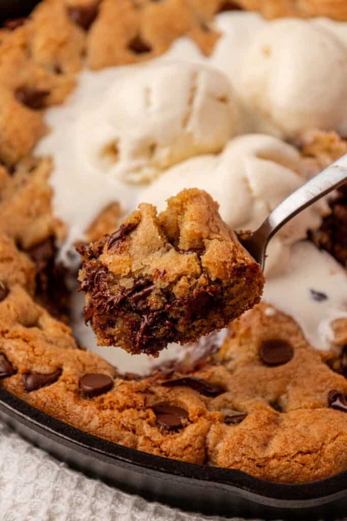 spoon holding a bite of pizookie